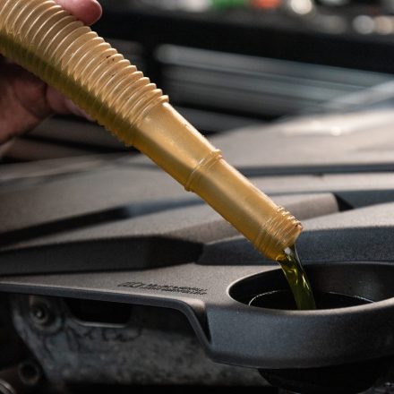 Close-up of professional Porsche servicing, ensuring high-performance engine maintenance at Auto 2000.
